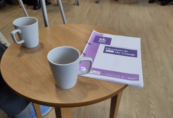 Notes of Literature in the Lounge on table with tea cups
